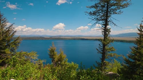 Looking Over Blue Lake Water Clear Summer Sky Above