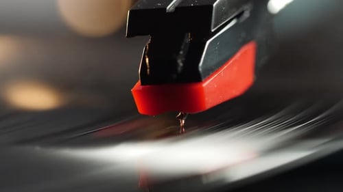 Record Player Needle on Spinning Vinyl Record Close-up