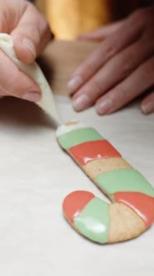 Vertical video. Creating a homemade Christmas gingerbread candy cane