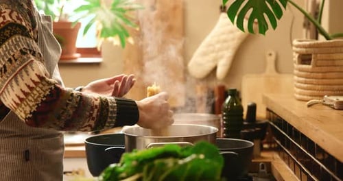 Hands, pot and pasta in house for cooking, flavor and dinner with meal prep