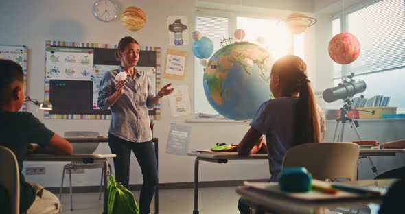 Teacher Explains Earth Science in Classroom, Education Stock Footage ft ...