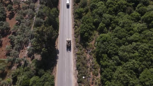 Heavily armed army Israel Defense forces patrolling the highway aerial