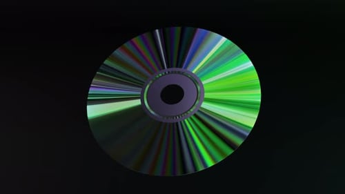 Abstract Concept CD DVD Disc on a Black Isolated Background Neon Blue Green Color Rainbow 3D