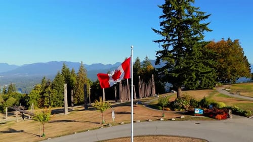 Canadian Flag Waving on Sunny Day, Aerial View