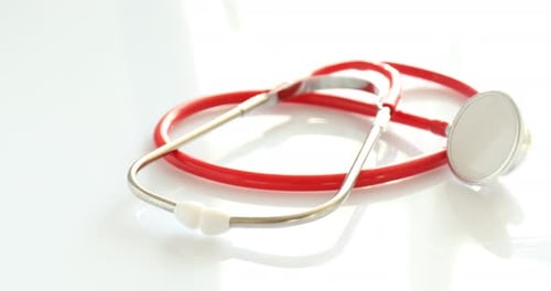 Red Stethoscope on a White Table, Medical Tool