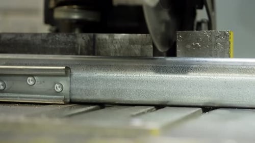 Industrial Metal Cutting Process Engineer Prepares Steel Structures with Saw