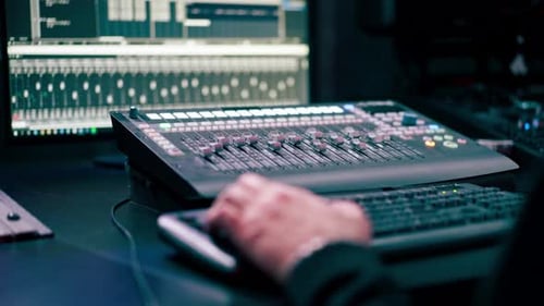 Close Up in the Recording Room Dark with Neon Lighting in the Studio the Sound Engineer Works at the