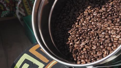 Coffee Beans Being Poured Into Grinder Close Up