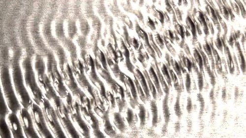 Abstract Waveforms Moving Across Frame