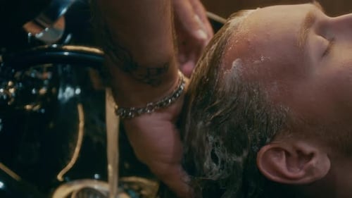 Stylish Man Getting Hair Washed in Barbershop