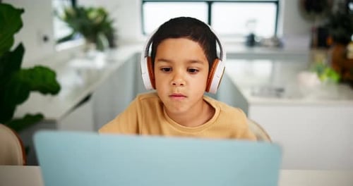 Laptop, home school and headphones for education with boy student in online class for child