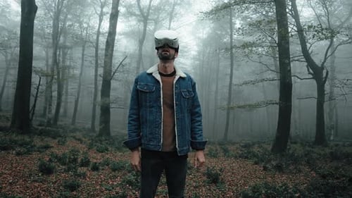 Man Using VR Headset in Misty Forest