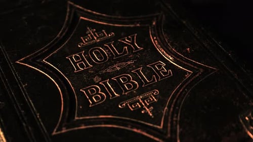 close up of the holy bible with a dark background