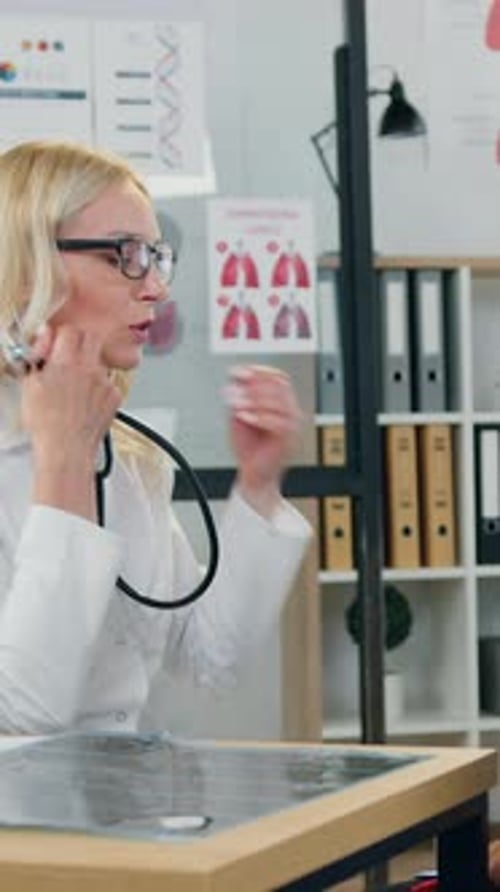 Doctor Listens to Child's Heart with Father Present