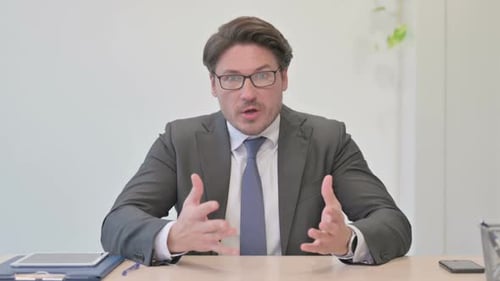 Portrait of Angry Middle Aged Businessman Fighting in Office