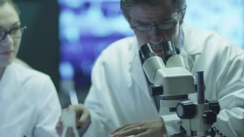Professor and Student Girl are Doing Chemical Researches in Laboratory.