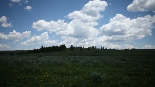 Time lapse clouds over lush Wyoming countryside near Yellowstone national park