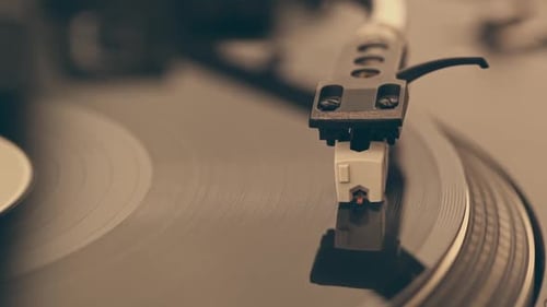 DJ Headshell on Spinning Turntable Listening the Music on Vinyl