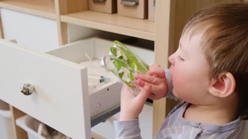 Boy with Brown Hair Plays with Syringe