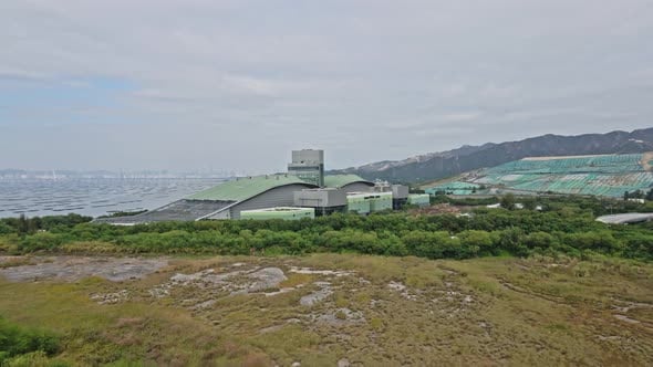 Drone flying towards T Park Sludge Treatment Centre in Tuen Mun Tsang ...