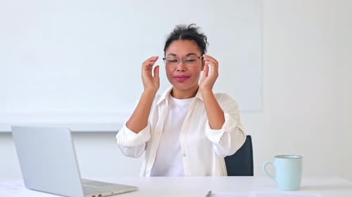 Professional Businesswoman Smiling Confidently in Office