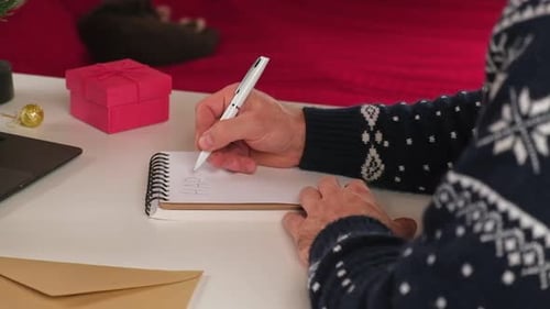 Writing a Christmas Wishing Card Male Adult Making Greeting Cards at Home Office During Xmas Man