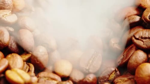 Roasting Coffee Beans with Smoke on Dark Background Close Up Arabica Robusta Colombian Beans