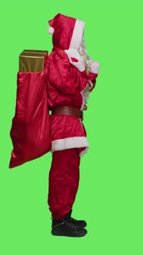 Vertical Video Profile of Sleepy Person in Santa Suit Yawning