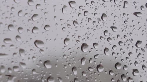 Raindrops Running Down a Windowpane