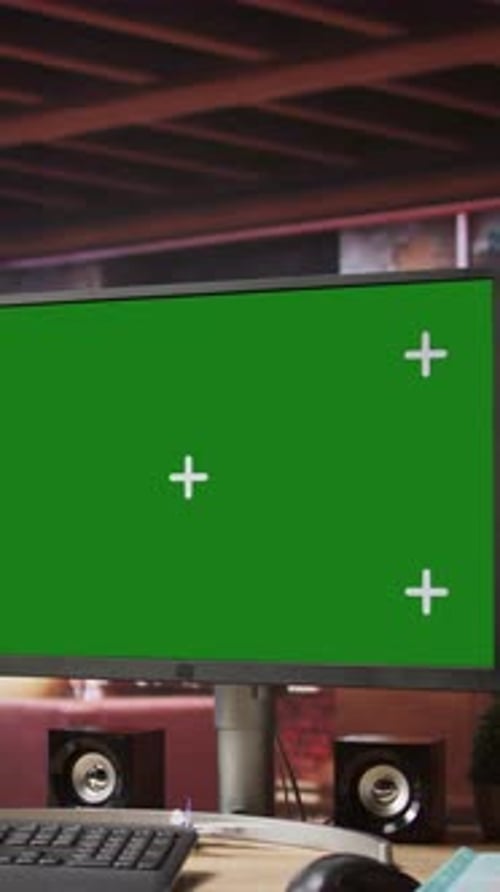 Vertical Video Green Screen Computer Monitor on Wooden Desk in Modern Home