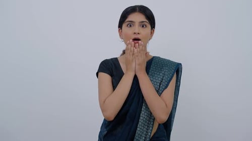 Woman Expressing Surprise and Shock in Studio