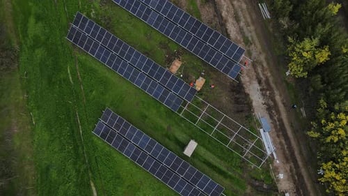 Solar panel technician installing solar panels