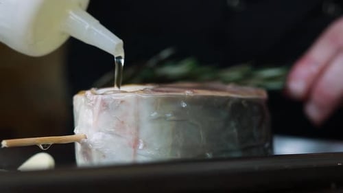 chef prepares a salmon dish in the kitchen. Close-up shots