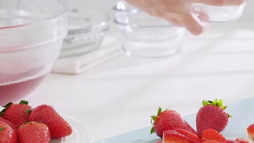 Fresh Strawberries and Glass Bowls on White Table