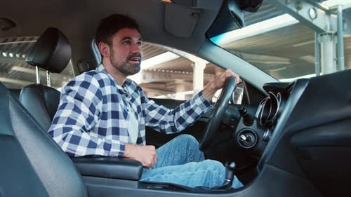 Happy Young Man Ready to Make First Test Drive Slow Motion