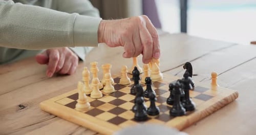 Mature Adult Playing Chess Game on Chessboard