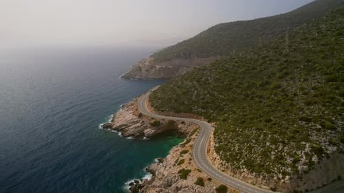 An Empty Winding Road Along the Sea Drone Shot
