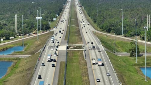 Aerial View of American Freeway with Many Driving Cars During Rush Hour in Florida View From Above