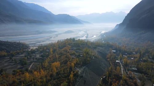 Aerial view of Indus River winding through autumn valley, Pakistan.