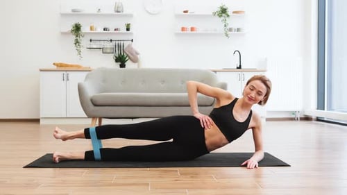 Woman Doing Leg Workout With Resistance Band