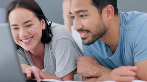 Asian couple, happy and laptop streaming in home bedroom in lockdown on movie subscription channel