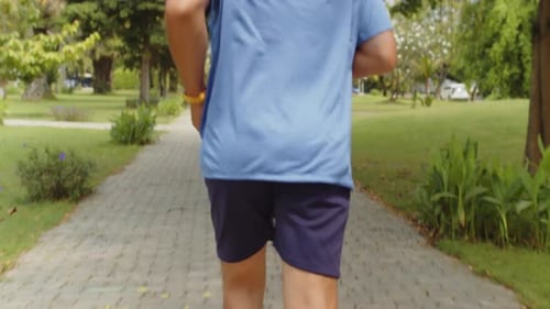 Professional Athlete Jogging Alone in Park