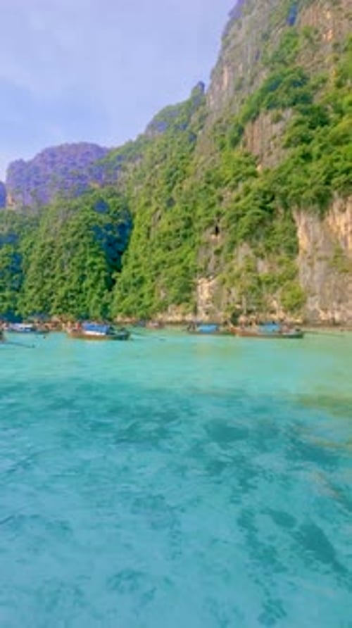 Longtail Boats and Green Blue Turqouse Lagoon at Pileh Lagoon Tropical Island Koh Phi Phi Thailand