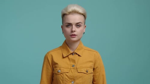 Young Woman Poses with Impatient Eye Roll