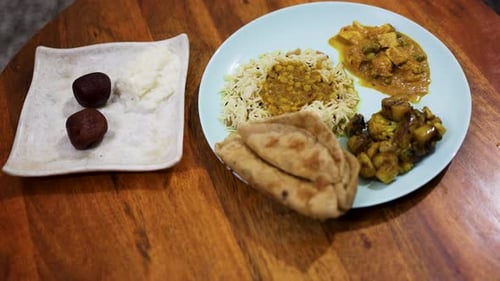 Traditional north indian meal featuring paneer curry and basmati rice