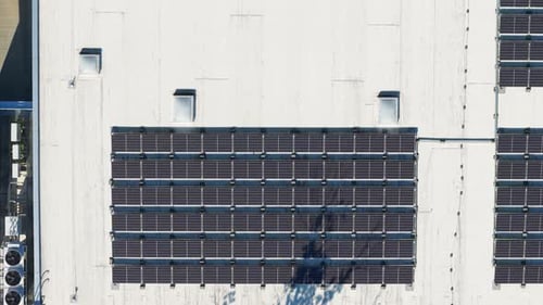 Aerial View Solar Panels on Commercial Building Roof