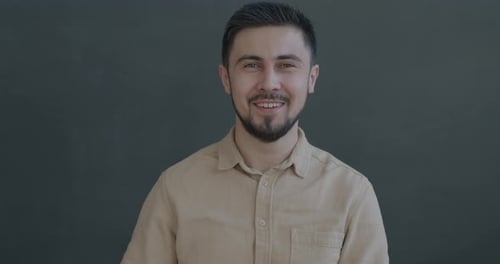 Smiling Man Gives Okay Hand Gesture