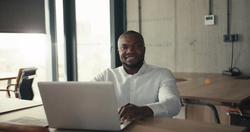 Portrait of a Happy Businessman in the Office Middleaged Man in a White Shirt Smiling and Looking at