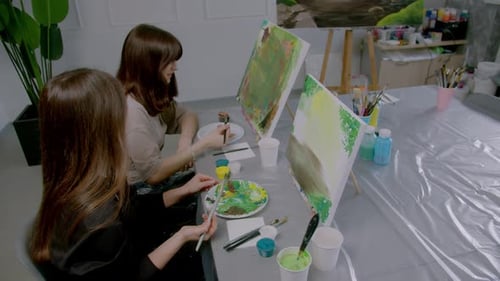 Two Women Painting a Picture Together