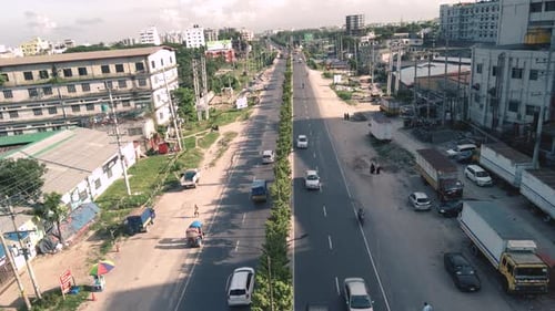 Aerial shot of a busy road where vehicles are passing in Dhaka, Bangladesh,